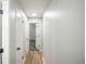 Bright hallway with hardwood floors and access to multiple rooms at 863 S Dudley St, Lakewood, CO 80226