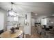 Open-concept kitchen featuring white cabinets, granite countertops, and stainless steel appliances at 863 S Dudley St, Lakewood, CO 80226