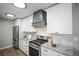 Bright, updated kitchen with stainless steel appliances and new countertops at 863 S Dudley St, Lakewood, CO 80226