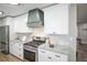 Updated kitchen featuring stainless steel appliances and granite countertops at 863 S Dudley St, Lakewood, CO 80226