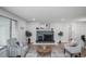 Inviting living room featuring a stone fireplace and comfortable seating area at 863 S Dudley St, Lakewood, CO 80226