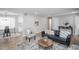 Open-concept living area with modern decor and a seamless flow to the kitchen at 863 S Dudley St, Lakewood, CO 80226