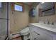 Bathroom featuring a modern toilet, marble countertop vanity, new fixtures, and a glass shower at 207 County Road 65, Evergreen, CO 80439
