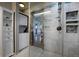 Modern bathroom featuring a glass-enclosed shower, sleek fixtures, and a washer/dryer at 207 County Road 65, Evergreen, CO 80439
