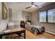 Cozy bedroom featuring a twin bed, desk, mountain views, and hardwood floors at 207 County Road 65, Evergreen, CO 80439