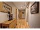 Hallway with wood floors, neutral walls, and stylish lighting fixtures at 207 County Road 65, Evergreen, CO 80439