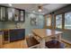 Additional dining space featuring custom wood cabinets, granite countertops and a mini-bar area at 207 County Road 65, Evergreen, CO 80439