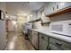 Convenient laundry area with a sink, wooden countertops, and a microwave at 207 County Road 65, Evergreen, CO 80439