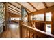 Bright and airy open concept living space with vaulted ceilings, a stone fireplace and many windows at 207 County Road 65, Evergreen, CO 80439