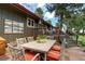 Charming outdoor dining area featuring a stone table and decorative chairs, perfect for entertaining guests at 207 County Road 65, Evergreen, CO 80439