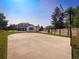 Spacious backyard featuring a basketball court and green lawn, ideal for recreation at 9451 W Hialeah Pl, Littleton, CO 80123