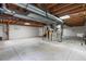 Unfinished basement offers ample storage and utility connections at 9451 W Hialeah Pl, Littleton, CO 80123