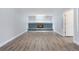 Spacious basement with modern electric fireplace and wood floors at 9451 W Hialeah Pl, Littleton, CO 80123