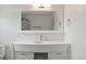 Modern bathroom with a white vanity, sleek mirror, and contemporary fixtures for a clean aesthetic at 9451 W Hialeah Pl, Littleton, CO 80123