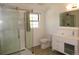 Modern bathroom with a glass-enclosed shower, sleek vanity, and updated fixtures at 9451 W Hialeah Pl, Littleton, CO 80123
