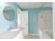 Bathroom featuring tile surround tub/shower and granite top vanity at 9451 W Hialeah Pl, Littleton, CO 80123