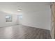Bright, spacious bedroom with laminate flooring and large windows offering nice views, creating a welcoming space at 9451 W Hialeah Pl, Littleton, CO 80123