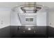 Contemporary kitchen with stainless vent hood over island with a view of the front living room at 9451 W Hialeah Pl, Littleton, CO 80123