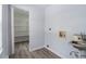 Laundry room features a utility sink and a walk in pantry at 9451 W Hialeah Pl, Littleton, CO 80123
