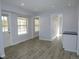 Living room area featuring wood-look floors and access to the backyard at 9451 W Hialeah Pl, Littleton, CO 80123