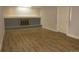 Spacious living room with a decorative fireplace and wood-look flooring, perfect for gathering at 9451 W Hialeah Pl, Littleton, CO 80123