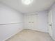 The carpeted bedroom features a large closet, light paint, and a bright ceiling light at 7477 Holland Ct, Arvada, CO 80005