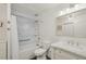 Bright bathroom featuring patterned tile accent wall, updated fixtures, and a modern vanity at 705 S Alton Way # 4D, Denver, CO 80247