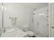 Modern bathroom featuring a glass enclosed shower, white subway tile, and neutral fixtures at 705 S Alton Way # 4D, Denver, CO 80247