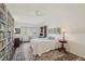 Inviting bedroom with large windows, ceiling fan, and stylish rug at 705 S Alton Way # 4D, Denver, CO 80247