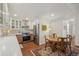 Updated kitchen with stainless steel appliances, wooden table and chairs, and decorative lighting at 705 S Alton Way # 4D, Denver, CO 80247