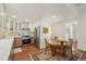 Updated kitchen with stainless steel appliances, wooden table and chairs, and decorative lighting at 705 S Alton Way # 4D, Denver, CO 80247