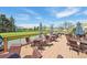 Patio featuring tables and seating for dining along the green golf course at 705 S Alton Way # 4D, Denver, CO 80247