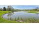 Scenic view of a pond surrounded by lush greenery and a tranquil fountain at 705 S Alton Way # 4D, Denver, CO 80247