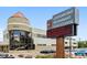 Commercial building exterior with peaked roof, large windows and electronic sign at 655 S Alton Way # 8D, Denver, CO 80247