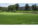 Picturesque golf course with lush green fairways, a pond and well-maintained landscaping at 655 S Alton Way # 8D, Denver, CO 80247