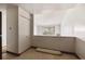 Neutral hallway featuring a closet with natural light and a view to the balcony at 655 S Alton Way # 8D, Denver, CO 80247