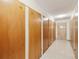 Hallway lined with storage lockers, offering convenient and secure space for residents at 655 S Alton Way # 8D, Denver, CO 80247