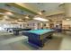 Relaxing pool room featuring several pool tables with soft lighting, and ample seating at 655 S Alton Way # 8D, Denver, CO 80247