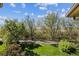 Balcony view overlooking beautifully landscaped grounds, perfect for relaxation and nature at 655 S Alton Way # 8D, Denver, CO 80247