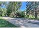 Shaded walking path lined with mature trees and landscaping for walking and recreation at 655 S Alton Way # 8D, Denver, CO 80247