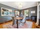 Dining room with gray walls, hardwood floors, and classic wood trim at 3044 W 40Th Ave, Denver, CO 80211