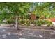 Quaint brick home framed by mature shade trees at 3044 W 40Th Ave, Denver, CO 80211