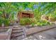 Charming brick home with a landscaped front yard and stone retaining wall at 3044 W 40Th Ave, Denver, CO 80211