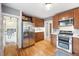 Well-equipped kitchen with stainless steel appliances and wooden cabinets at 3044 W 40Th Ave, Denver, CO 80211