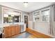 Bright kitchen with stainless steel appliances, sink, and wood cabinets with a modern design, and an eat in kitchen area at 3044 W 40Th Ave, Denver, CO 80211