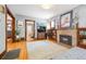 Inviting living room with fireplace, hardwood floors, and natural light at 3044 W 40Th Ave, Denver, CO 80211