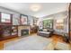 Bright living room featuring a fireplace, hardwood floors, and large windows at 3044 W 40Th Ave, Denver, CO 80211