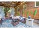 Cozy outdoor patio featuring a comfortable seating area, egg chair, and string lights at 3044 W 40Th Ave, Denver, CO 80211