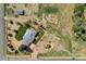 Expansive aerial view of the property, highlighting the solar panels, large lot, and surrounding area at 16816 E Costilla Ave, Foxfield, CO 80016