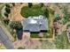 Aerial view of the property showcasing solar panels, a patio, and a well-kept lawn at 16816 E Costilla Ave, Foxfield, CO 80016